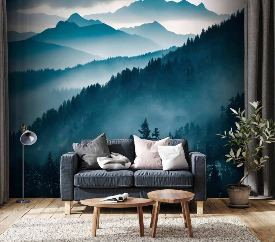 Mountain range with trees and fog