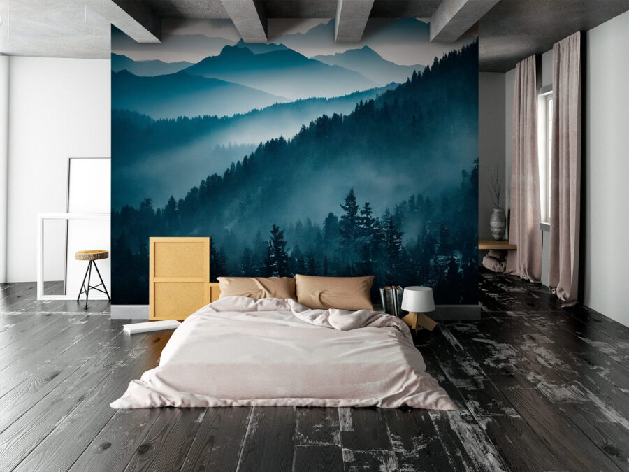 Mountain range with trees and fog