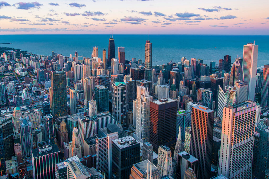 City with tall buildings and a body of water City with tall buildings and a body of water