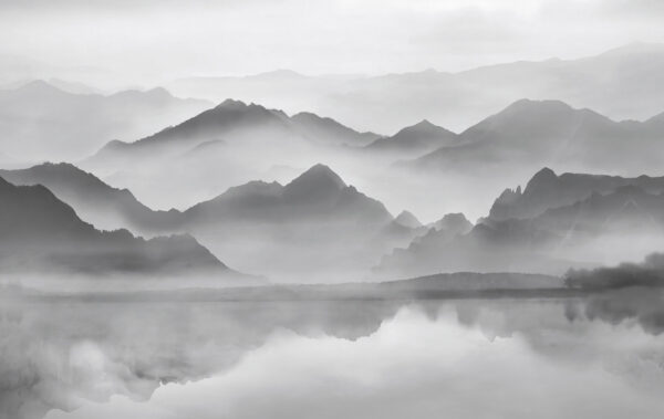 Mountain range with fog and water Mountain range with fog and water