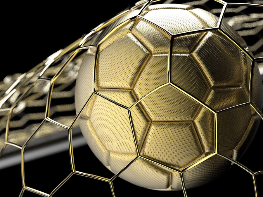 Gold football ball in a net