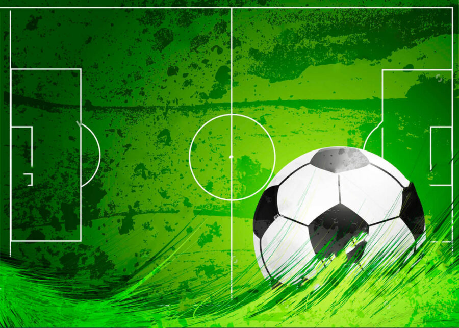 Football ball on a green field