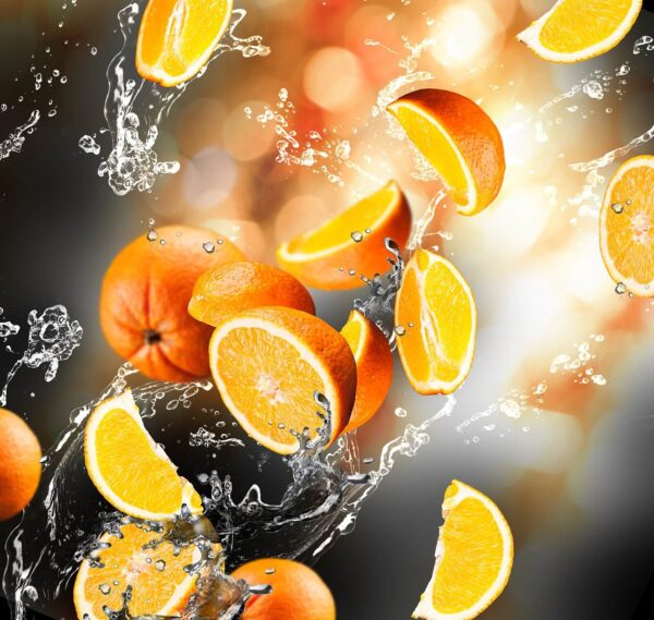 Oranges falling into water with water splashing Oranges falling into water with water splashing