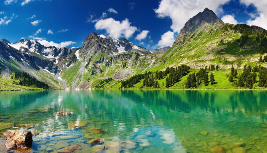 Body of water with mountains and trees