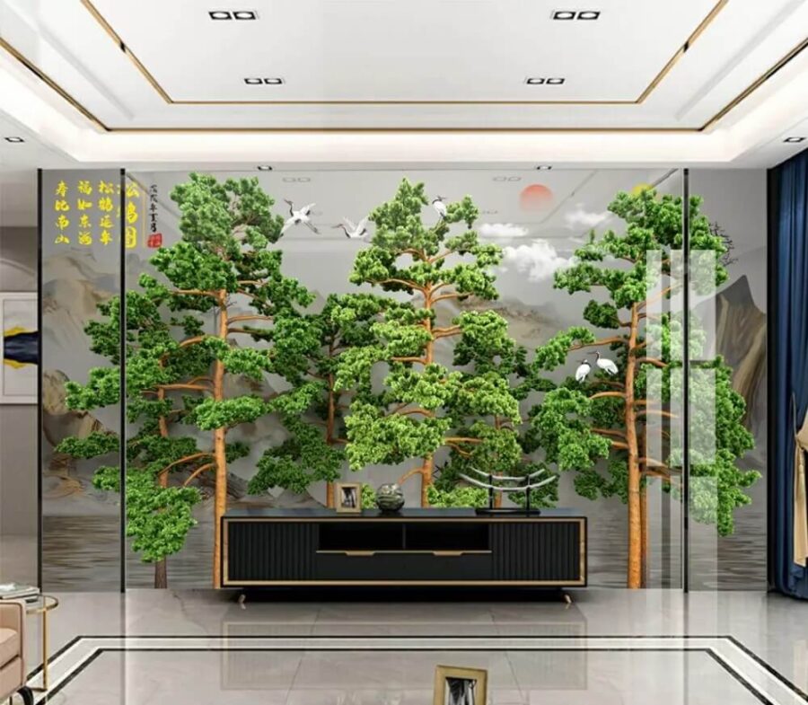Group of trees with birds flying above them