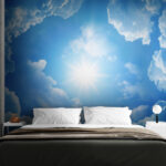 Wall mural The sun shining through clouds