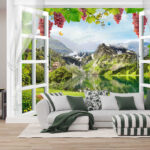 Wall mural Window with a view of a lake and mountains
