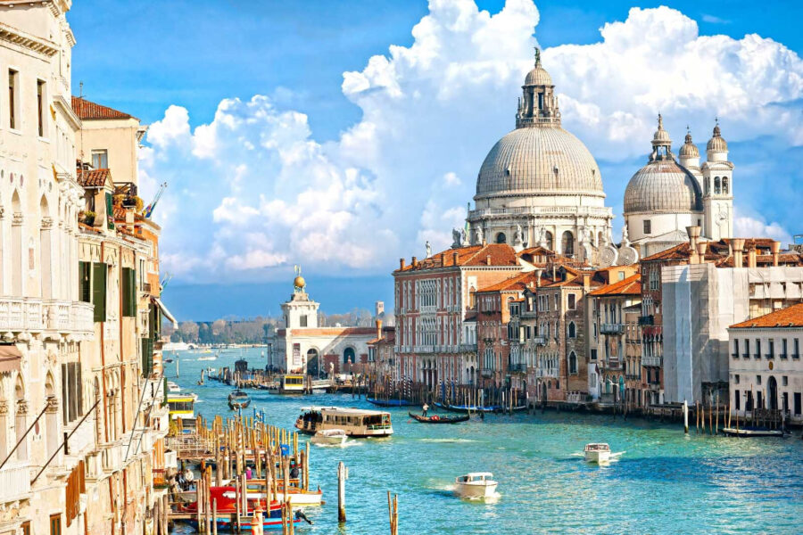 Water way with boats and buildings in the background