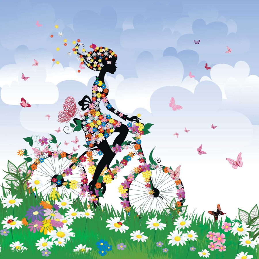 Woman riding a bicycle with flowers