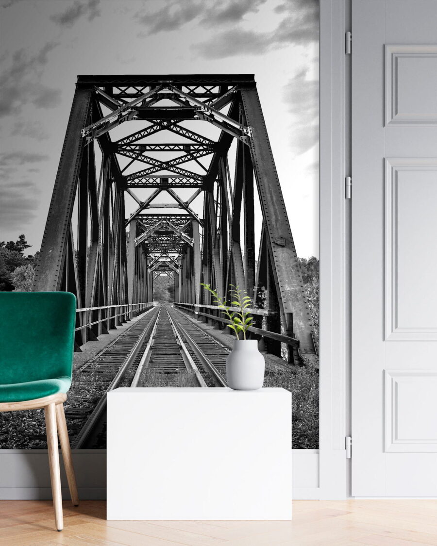 Train tracks going through a bridge