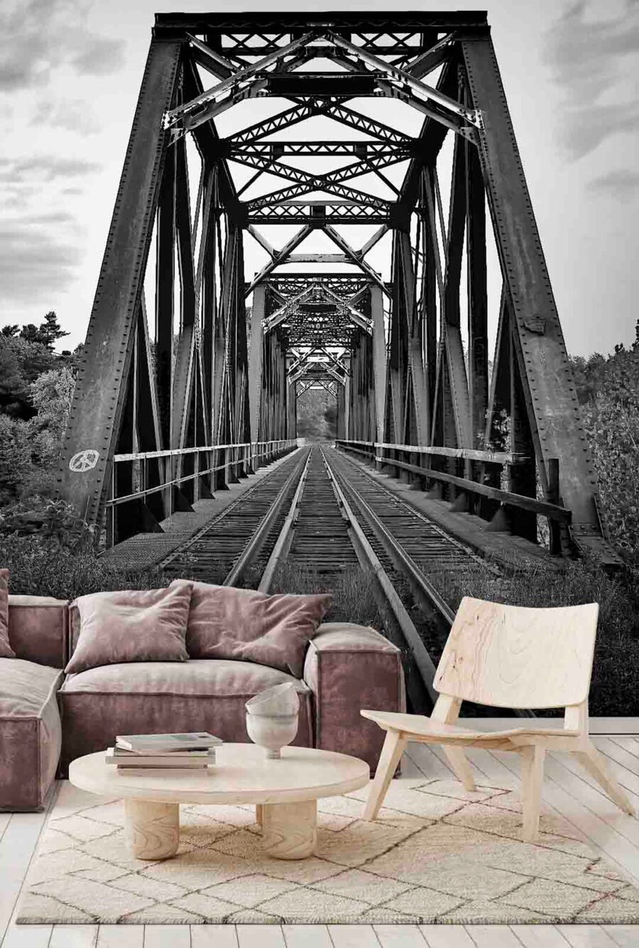 Train tracks going through a bridge