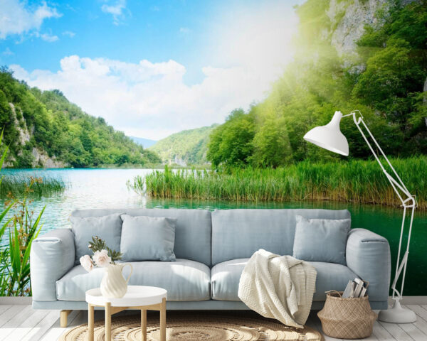 Body of water with grass and trees around it Body of water with grass and trees around it
