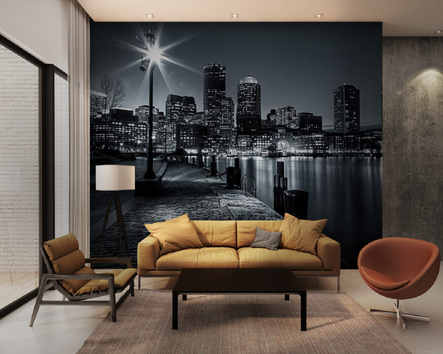 A city skyline with lights on the water