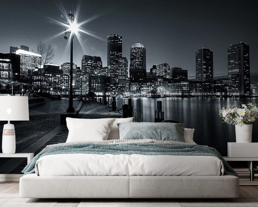 A city skyline with lights on the water