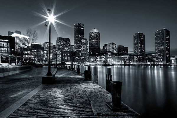 A city skyline with lights on the water A city skyline with lights on the water