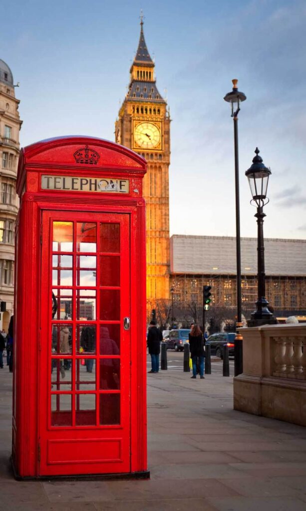 Red telephone booth in a city Red telephone booth in a city