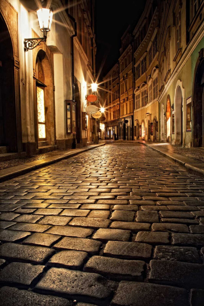 Stone street with buildings and street lights Stone street with buildings and street lights