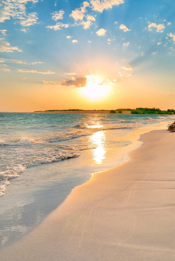 Beach with waves and a sunset Beach with waves and a sunset