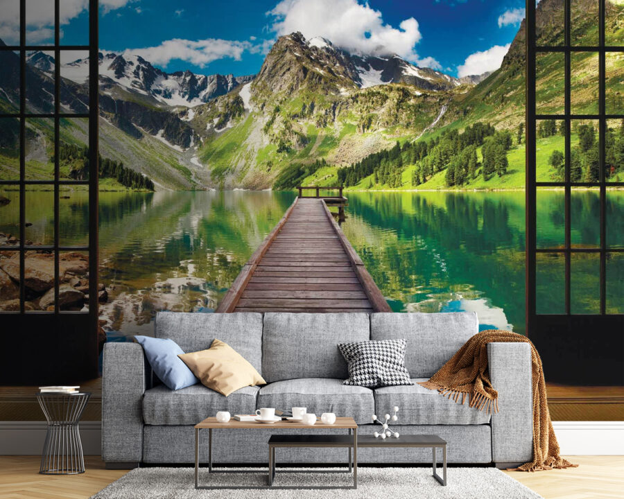 View of a lake from a room with a wooden dock and mountains