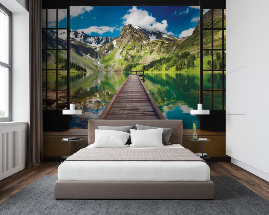 View of a lake from a room with a wooden dock and mountains