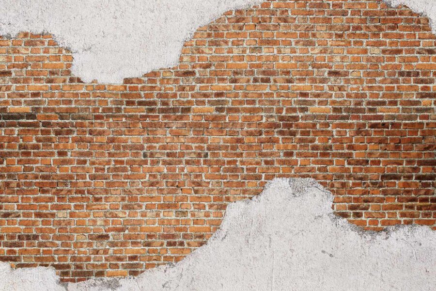 Brick wall with a white layer