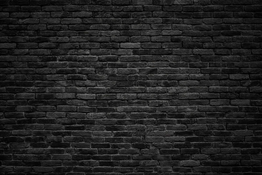 Wall murals Black brick wall with a white spot - Image 3