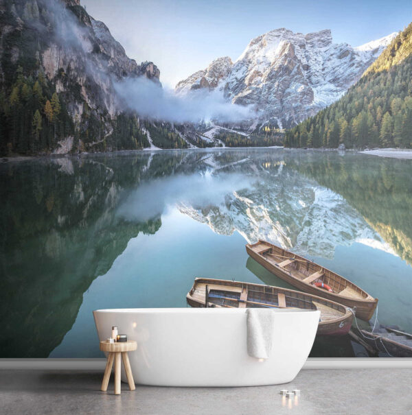 Boats on a lake with mountains in the background Boats on a lake with mountains in the background