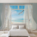 Wall murals View of a beach from a room with a bird flying over it