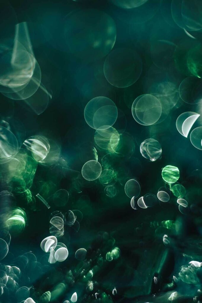 Blurry image of green and white circles Blurry image of green and white circles