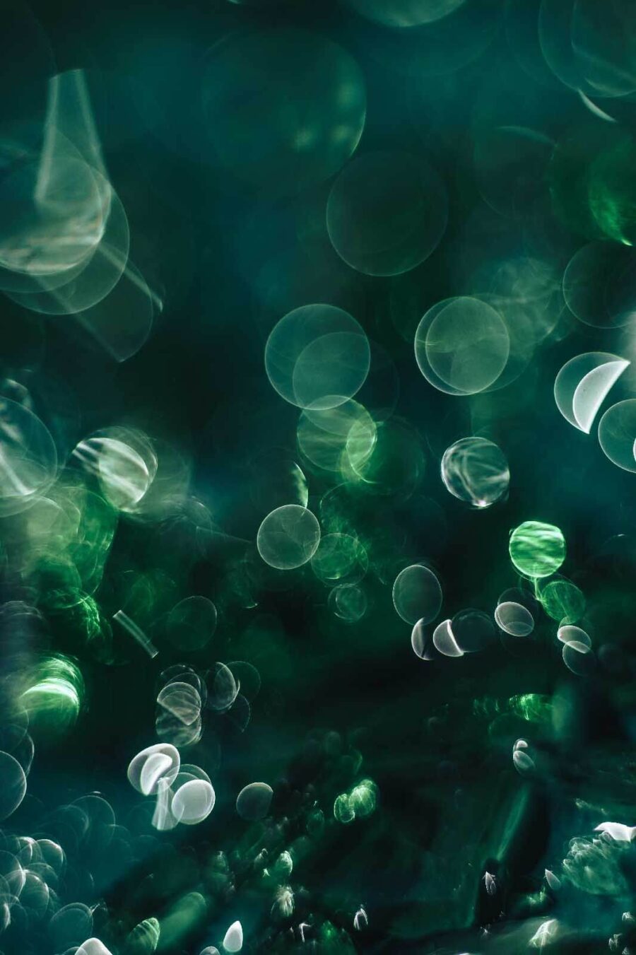 Blurry image of green and white circles