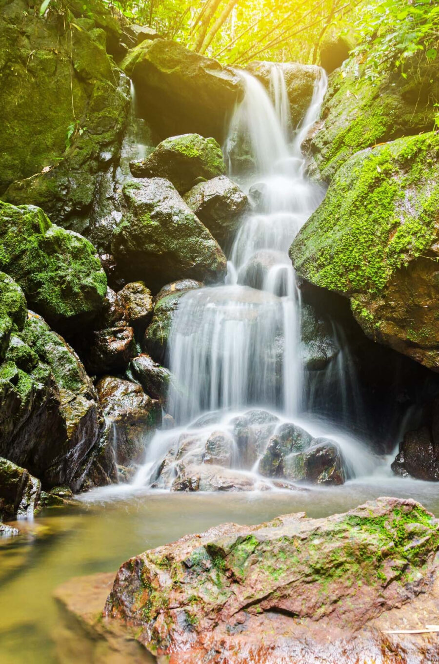 Waterfall over rocks with moss