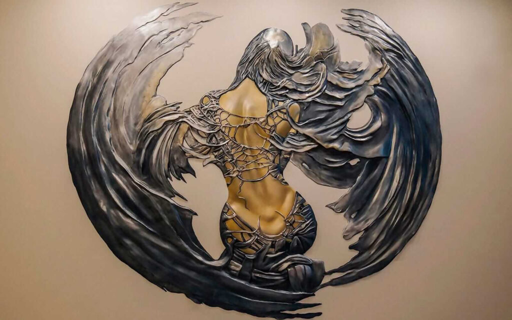 Metal sculpture of a woman with wings Metal sculpture of a woman with wings
