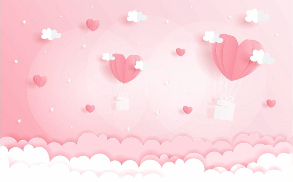 Pink paper cutout of hot air balloons and clouds Pink paper cutout of hot air balloons and clouds