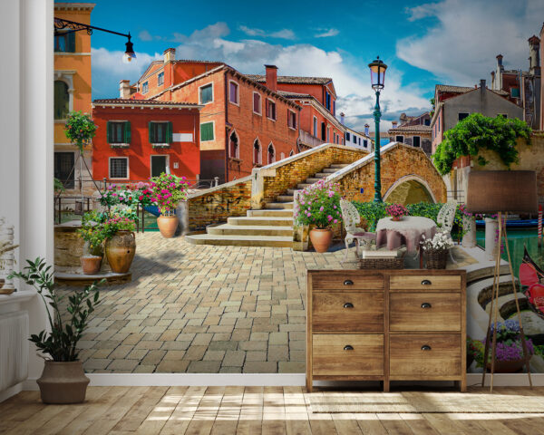 Patio with a table and chairs and a fountain in front of a building Patio with a table and chairs and a fountain in front of a building