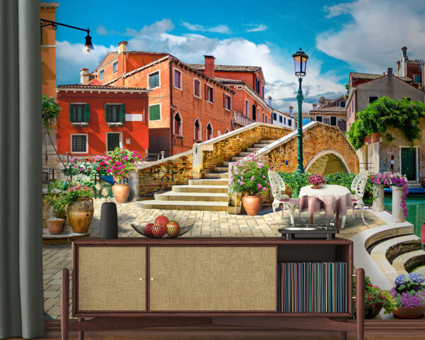Patio with a table and chairs and a fountain in front of a building Patio with a table and chairs and a fountain in front of a building