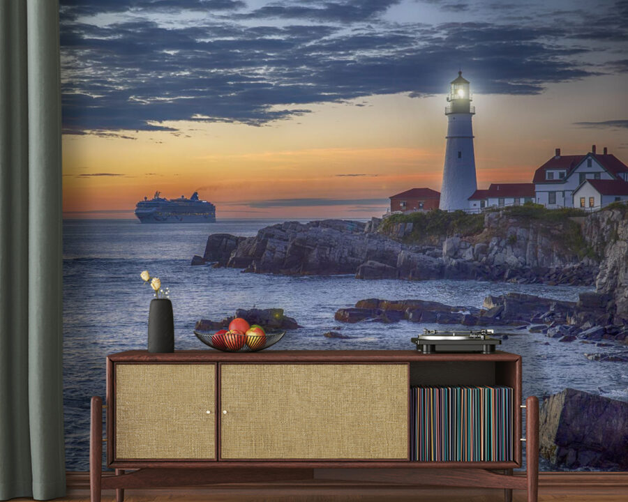 Lighthouse on a rocky shore with a cruise ship in the background