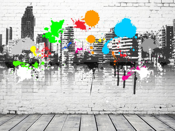 White brick wall with colorful paint splatters White brick wall with colorful paint splatters