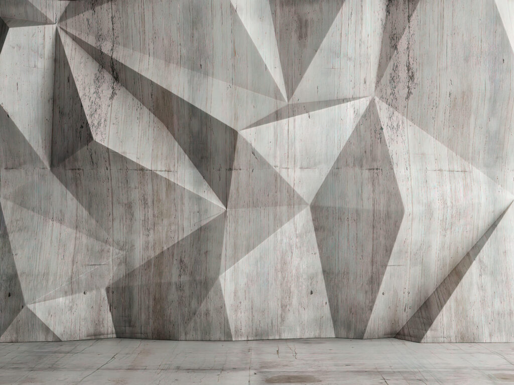A concrete wall with a triangular pattern A concrete wall with a triangular pattern