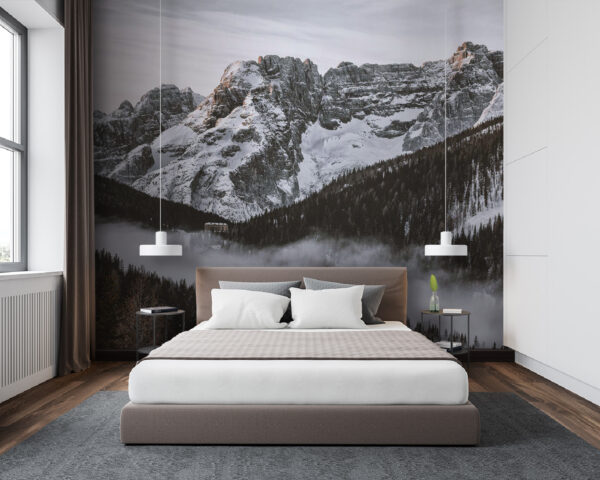 Snowy mountain range with trees and a building Snowy mountain range with trees and a building