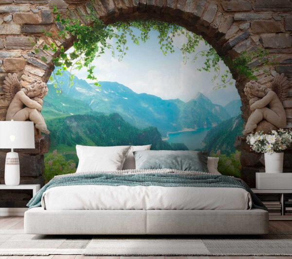 Stone archway with stone statues and a view of a valley and mountains Stone archway with stone statues and a view of a valley and mountains