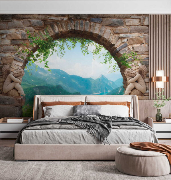 Stone archway with stone statues and a view of a valley and mountains Stone archway with stone statues and a view of a valley and mountains