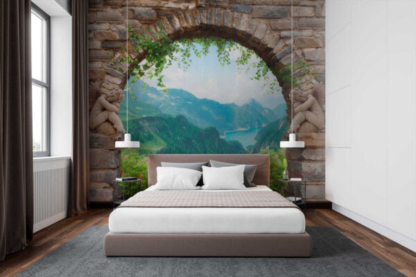 Stone archway with stone statues and a view of a valley and mountains Stone archway with stone statues and a view of a valley and mountains