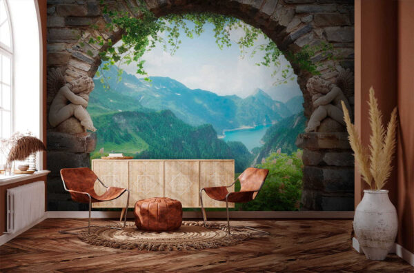 Stone archway with stone statues and a view of a valley and mountains Stone archway with stone statues and a view of a valley and mountains