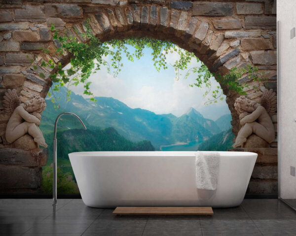 Stone archway with stone statues and a view of a valley and mountains Stone archway with stone statues and a view of a valley and mountains