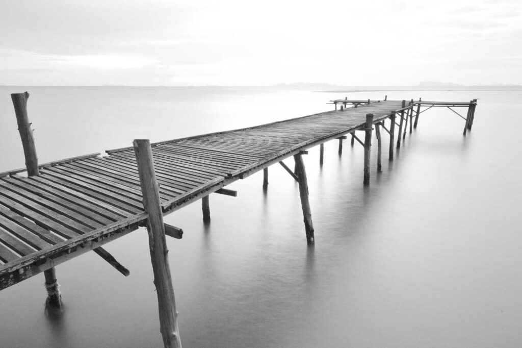 Long wooden bridge over water Long wooden bridge over water