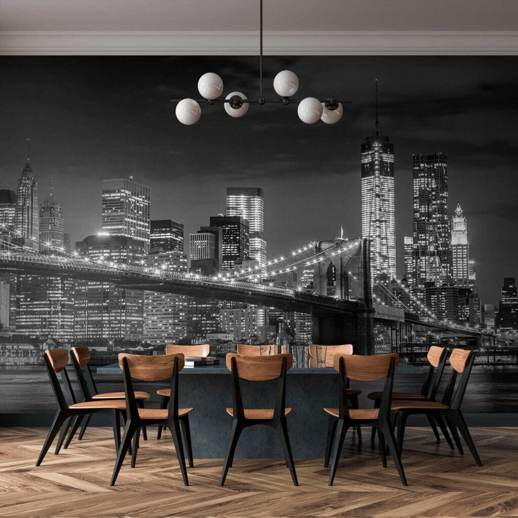 Bridge over water with city skyline at night