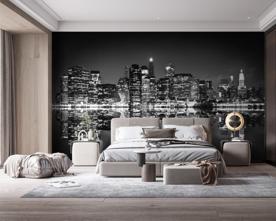 City skyline at night with lights reflecting on water