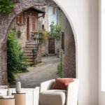 Stone archway with plants and stairs Wall mural Stone archway with plants and stairs