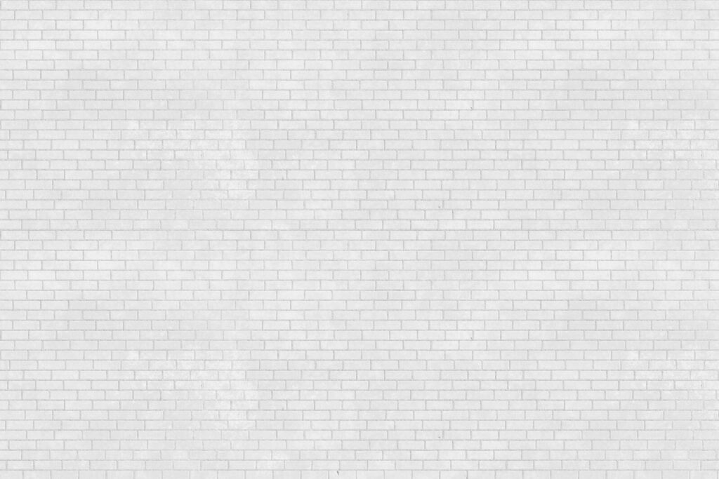 White brick wall with many small bricks White brick wall with many small bricks