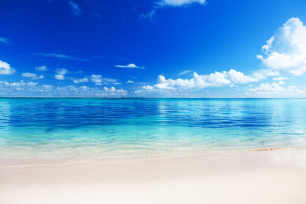 Beach with blue water and clouds Beach with blue water and clouds